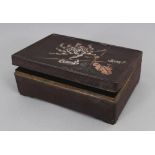 A SIGNED JAPANESE MEIJI PERIOD MIXED METAL RECTANGULAR BOX, the hinged cover decorated with