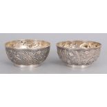 A NEAR PAIR OF GOOD QUALITY 19TH CENTURY CHINESE SILVER BOWLS, circa 1900, weighing approx. 280gm in