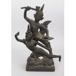 A Bronze Figure of a Kinnara, Thailand, 20th century, the winged deity holding an axe, riding on the