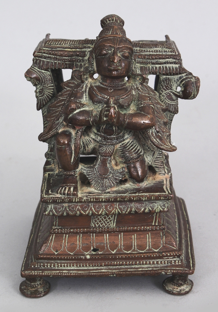 A Bronze Base from a Vishnu Shrine, Tamil Nadu, South India, 19th century, depicting a crouching