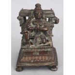 A Bronze Base from a Vishnu Shrine, Tamil Nadu, South India, 19th century, depicting a crouching