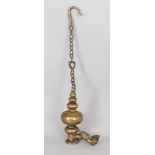 A Brass Hanging Temple Lamp, Burma, 18th/19th century, of segmented bottle shaped form, with