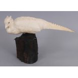 A FINE QUALITY JAPANESE MEIJI PERIOD IVORY OKIMONO OF A PHEASANT, with metal feet and a wood tree