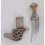 A South Arabian Dagger (Khanjar), early 20th century, with curved ridged blade, horn and white metal