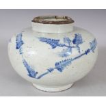 AN UNUSUAL 19TH CENTURY KOREAN BLUE & WHITE PORCELAIN VASE, the sides painted with spreading