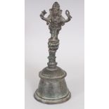 A 19TH/20TH CENTURY INDIAN BRONZE BELL, the handle cast in the form of Ganesh, 8.5in high.