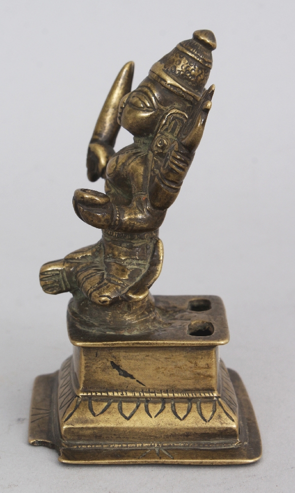 A Brass Figure of Durga, Western Deccan, India, circa 18th century, seated on a raised plinth, the - Image 4 of 6