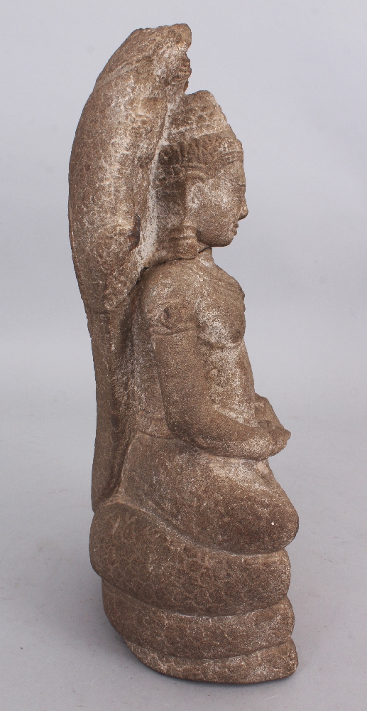 A Khmer Style Sandstone Figure of Buddha Seated under Mucalinda, seated in sattvasana on the - Image 2 of 6