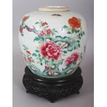 A 19TH CENTURY CHINESE FAMILLE ROSE PORCELAIN JAR, together with a wood stand, the jar painted