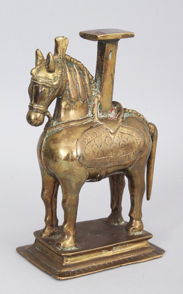 A Temple Lampstand, Northern India, 19th century, in the form of a horse, on rectangular base, the