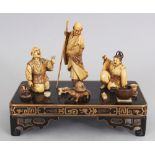 A GOOD JAPANESE IVORY & LACQUERED WOOD OKIMONO, depicting a scene of the tanuki badger