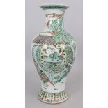 A LARGE 19TH/20TH CENTURY CHINESE FAMILLE VERTE BALUSTER PORCELAIN VASE, decorated with figures in a