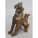 A Brass Figure of a Mythical Lion (Chinthe), Burma, early 20th century, with coloured glass and