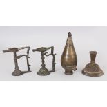 Four Indian Bronze Objects, 18th-19th century, comprising two small temple lamps, a huqqa burner