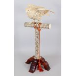 AN IMPRESSIVE LARGE JAPANESE MEIJI PERIOD SECTIONAL IVORY MODEL OF A HAWK PERCHED ON A TALL STAND,