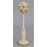 AN EARLY 20TH CENTURY CHINESE CONCENTRIC SECTIONAL IVORY BALL ON STAND, weighing approx 91gm in