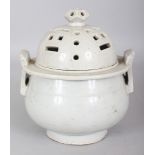 A RARE 18TH/19TH CENTURY KOREAN WHITE GLAZED PORCELAIN CENSER & COVER, the cover pierced with