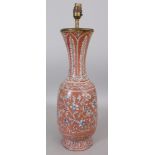 AN ISNIK STYLE CERAMIC VASE, converted to a lamp, decorated with scrolling foliage reserved on an