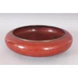 A LARGE EARLY 20TH CENTURY CHINESE RED GROUND CLOISONNE DRAGON BOWL, the base with a Ming mark, 11.