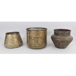 Three Brass Bowls, Egypt, 20th century, each with engraved and repouss figural decoration, with