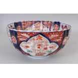 A 19TH CENTURY JAPANESE IMARI FLUTED PORCELAIN BOWL, 9.6in diameter & 4.7in high.