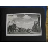 SINGAPORE / PHOTOGRAPHY: Small album of 18 photographs of Singapore. Ca. 1920s.