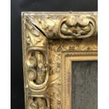 19th Century Italian School. A Partially Carved Giltwood Frame, with inset glass, 26" x 18" (