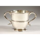 A GOOD PLAIN GEORGE II TWO-HANDLED CUP, with looped handles, the body with a plain band. 4.25ins