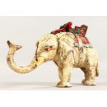 A VICTORIAN PAINTED CAST IRON MONEY BOX OF AN ELEPHANT. 5ins high.