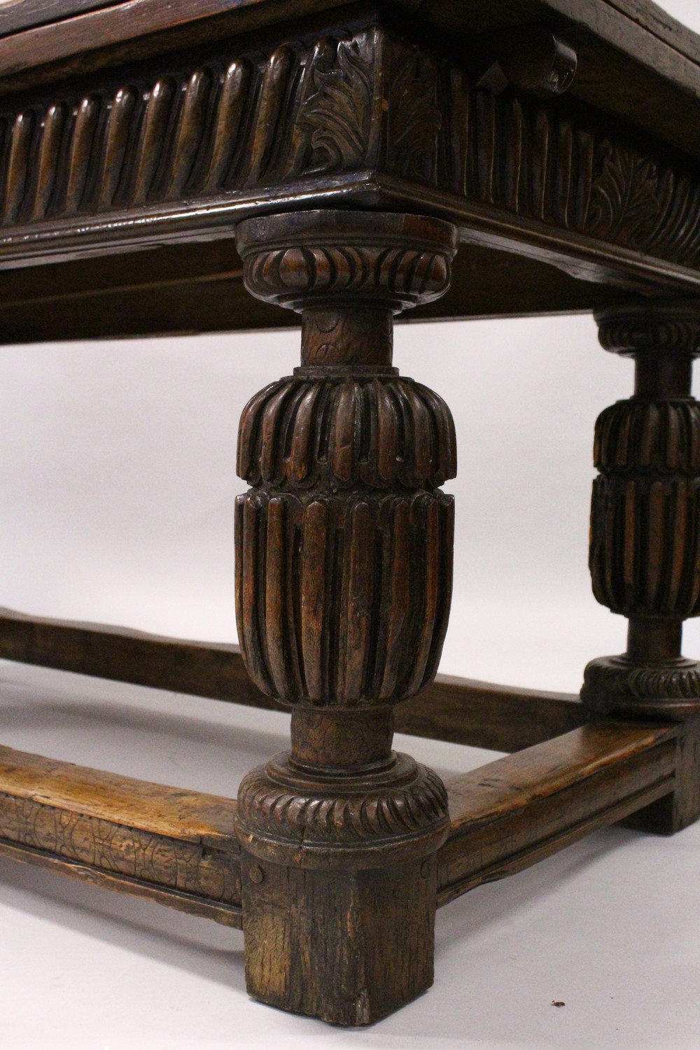 A GOOD 17TH/18TH CENTURY OAK DRAW LEAF TABLE, with a plain rectangular top, carved frieze on four - Image 3 of 9