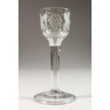 A GOOD GEORGIAN WINE GLASS, the bowl engraved with fruiting vines with raised foot. 6ins high.