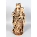 AN 18TH CENTURY CARVED WOOD, PAINTED AND GILDED MADONNA AND CHILD. 25ins high.