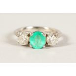 AN 18CT WHITE GOLD THREE STONE EMERALD AND DIAMOND RING of 2.4cts.
