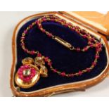 A GOOD VICTORIAN RUBY AND DIAMOND PENDANT AND CHAIN.