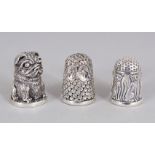 THREE NOVELTY SILVER THIMBLES.