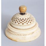 A EUROPEAN CARVED IVORY CIRCULAR PIERCED TABLE BELL. 3.5ins diameter.