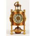 A RARE BRASS LIGHTHOUSE CLOCK, with three dials, clock, thermometer and barometer, each 2.5ins