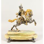 A LIMITED EDITION SILVER AND GILT METAL MODEL OF A HUSSAR ON HORSEBACK, mounted on an onyx base.