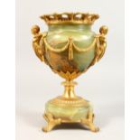 AN ONYX AND ORMOLU MOUNTED PEDESTAL VASE, with figural mounts. 10.5ins high.