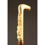 A RARE 19TH CENTURY FRENCH SWORD STICK, the ivory handle carved with garland and cupids head, with