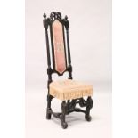 AN 18TH CENTURY HIGH BACK HALL CHAIR, later ebonised, with needlework back panel, similar seat on