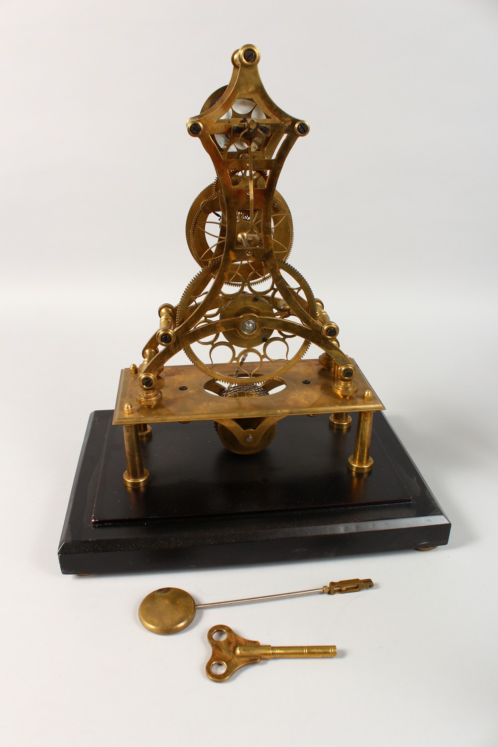 A MOON PHASE SKELETON CLOCK in a glass case. 17.5ins high including case. - Image 10 of 10