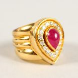 AN 18CT GOLD, CABOCHON RUBY AND DIAMOND HEART SHAPED RING.