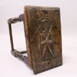 A 17TH/18TH CENTURY OAK JOINT STOOL, with plank top, carved with a male figure, fluted carved