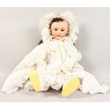 A LARGE S.F.B.J. PARIS, No. 301, BISQUE HEADED DOLL, in a white lace bonnet and dress.