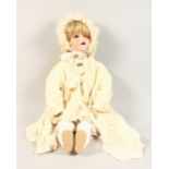 A SCHOENAU & HOFFMEISTER "PB STAR", Pattern 914, 11 BISQUE HEADED DOLL, in full dress with bonnet.