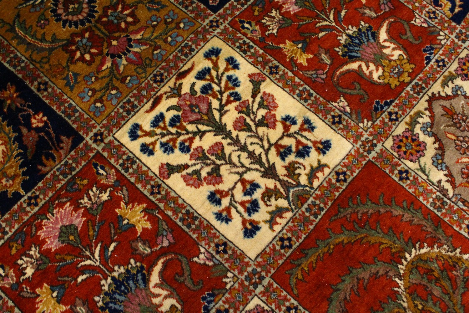 A VERY GOOD LARGE PERSIAN "GHOM" CARPET, the centre with seven rows of four floral motifs, varying - Image 6 of 10