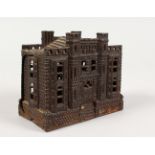 A VICTORIAN CAST IRON MONEY BOX, cast in the form of a castellated money bank, Named, Reg. No.