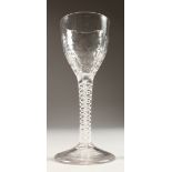 A GEORGIAN WINE GLASS, with cotton twist stem and honeycomb moulded bowl. 5ins high.