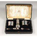 A THREE PIECE CRUET with spoons, in a fitted case. London 1940.